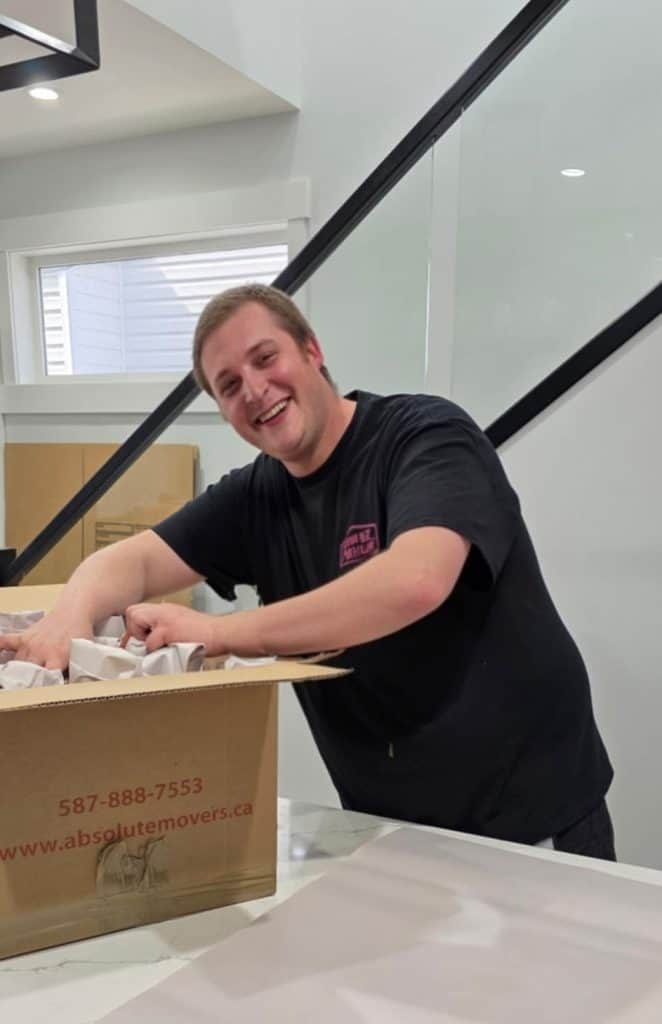 Absolute Moving & Delivery crew happily packs your household item
